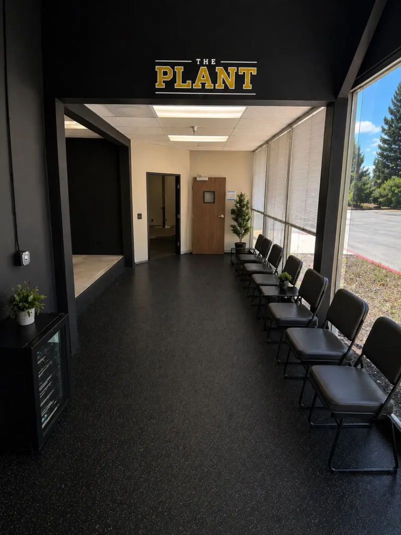 The waiting area, with seating along a window looking out to the parking lot.